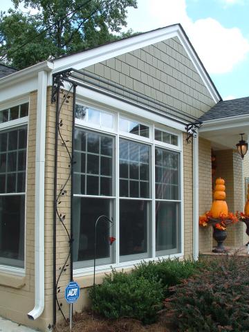 Custom fabricated trellis with plant shelf and leaf pattern