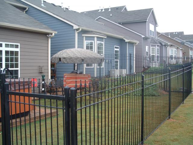 Three rail wrought iron fence