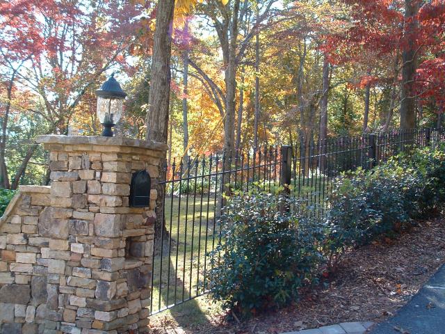 Wrought iron fence follwing slope instead of terraced